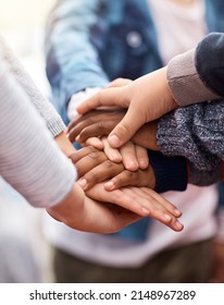 Friends Stick Together. Shot Of A Group Of Unrecognizable Elementary School Kids Joining Their Hands Together In A Huddle.