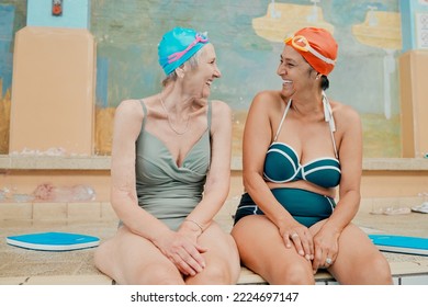 Friends, swimming and senior women on retirement vacation while happy, talking and having fun during funny conversation in swimwear. Water sport, learning and class for old people doing exercise