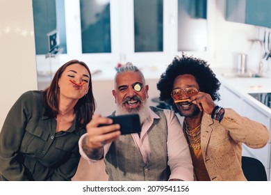 Friends Taking Selfies With Mobile Phone - People Playing With Food Making Weird Faces On A Dinner