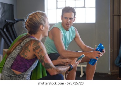 Friends Talking Chatting In Gym, Waiting For Their Group Workout Crossfit Class To Begin