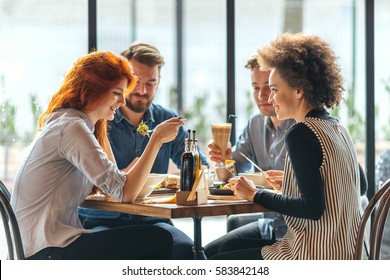 Friends  Talking And Having Fun At Dinner Party.