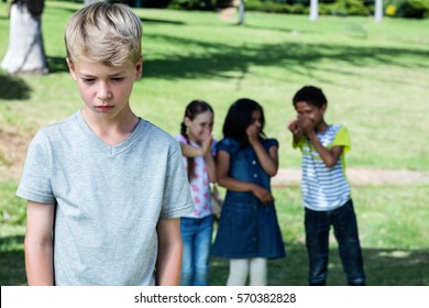 Friends Teasing A Boy In The Park