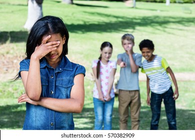 Friends Teasing A Girl In The Park