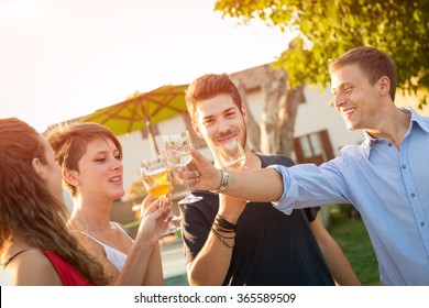 Friends Toasting At Party For The Happy Hour