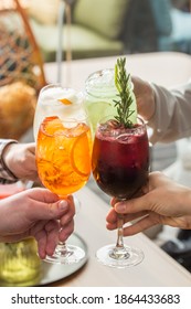 Friends Toasting Saying Cheers Hands Holding Summer Cold Cocktail Drinks On Cafe Background Side View