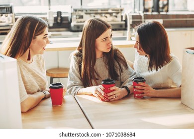 Friends trying to cheer up young depressed woman who needs help. People, friendship, togetherness - Shutterstock ID 1071038684