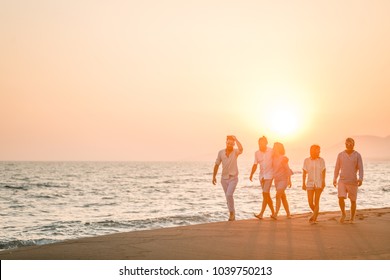 Friends Walking On The Beach