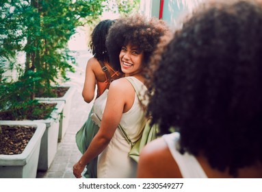 Friends walking, travel and city with black woman, adventure and happiness on summer vacation. Happy women, african girl and walk in metro, urban town or street for bonding, relax and exploring Paris - Powered by Shutterstock