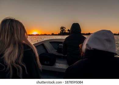 Friends Watching The Sunrise At The Lake. Buenos Aires, Buenos Aires, Argentina. November 10, 2020