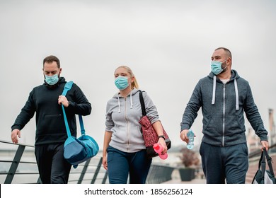 Friends Wearing Protective Face Mask Taking A Walk After A Good Training Session Outdoors