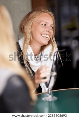 Friends, woman and drink in a cafe, relax and happiness with conversation, weekend break and laughing. People, girl and restaurant with a glass, speaking and funny with humor, talking and discussion