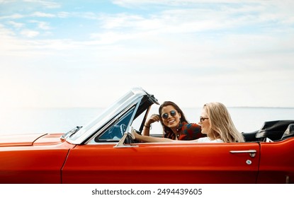 Friends, woman and driving convertible for road trip, adventure and freedom or luxury on vacation. Portrait of excited people and young driver with license, car or cool vehicle for journey and travel - Powered by Shutterstock