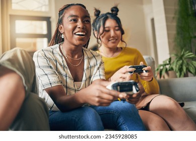 Friends, women and gaming on tv in home living room on sofa, smile and having fun online. Television, girls and play video game on couch, esports competition and bonding to relax in house together - Powered by Shutterstock