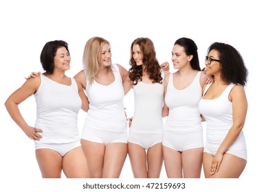 friendship, beauty, body positive and people concept - group of happy women different in white underwear