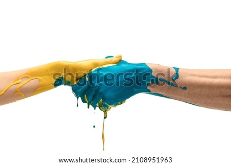 Friendship. Blue and yellow painted human hands handshaking isolated on white studio background. Concept of contemporary art, beauty, creativity, diversity, care, support and ad. Symbolism