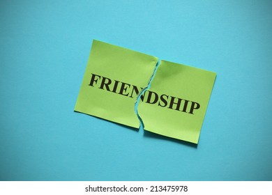 Friendship breakdown (destroy a friendship). Torn of paper with the word "Family". Concept Image. Closeup.
