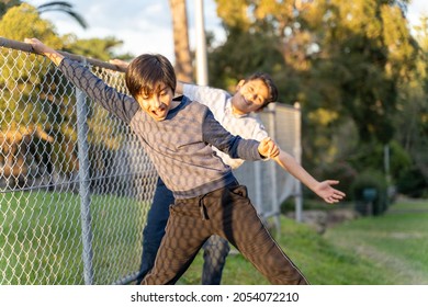 Friendship Concept. Two Young Boys Playing Together. South Asian Happy Kids Doing Playful Fist Fight. Children Having Fun. Candid Expressions.