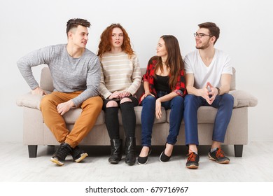 Friendship, education, students. Young people wait for exam, sitting at home interior and chatting