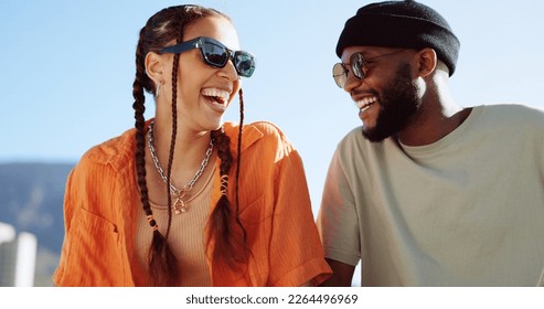 Friendship, flirting and couple with sunglasses in city sitting on building rooftop laughing. Love, friends and romance, urban dating and freedom for gen z woman and man with smile on crazy fun date. - Shutterstock ID 2264496969