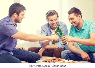 Friendship, Food And Leisure Concept - Smiling Male Friends With Beer And Pizza Hanging Out At Home