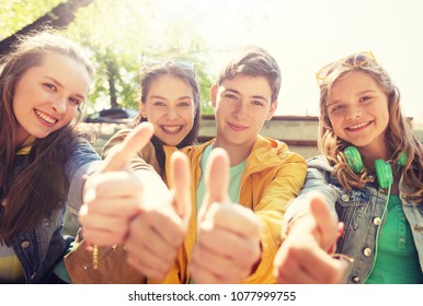 Friendship, Gesture And People Concept - Happy Teenage Friends Or High School Students Showing Thumbs Up