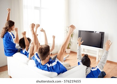 Friendship, Leisure, Sport, People And Entertainment Concept - Happy Friends Or Football Fans Watching Soccer On Tv And Celebrating Victory At Home