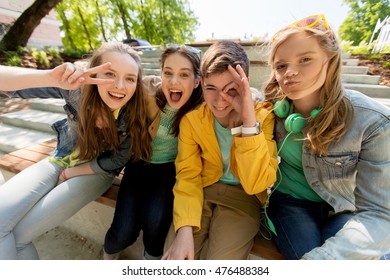 Friendship And People Concept - Happy Teenage Friends Or High School Students Having Fun And Making Faces