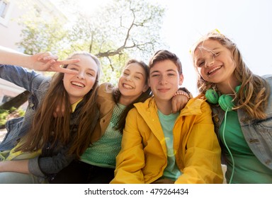 Friendship And People Concept - Happy Teenage Friends Or High School Students Having Fun And Making Faces