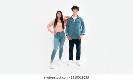Friendship And Relationship. Full Length Shot Of Happy Young Couple Posing Together Standing Over White Studio Background. Brunette Boyfriend And Girlfriend Advertising Offer For Youth. Panorama - Shutterstock ID 2310011055