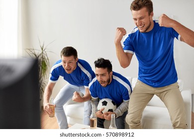 Friendship, Sport, People And Entertainment Concept - Happy Male Friends Or Football Fans With Beer Watching Soccer At Home