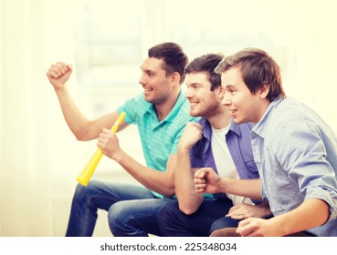 Friendship, Sports And Entertainment - Happy Male Friends With Vuvuzela Watching Sports At Home