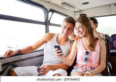friendship, summer vacation, transport, technology and people concept - smiling couple with smartphone traveling by bus and making selfie - Powered by Shutterstock