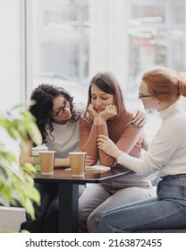 friendship and support in a difficult situation, three female friends discuss the problem and support each other, depression and sadness in a woman, group psychotherapy and support from friends and - Shutterstock ID 2163872455