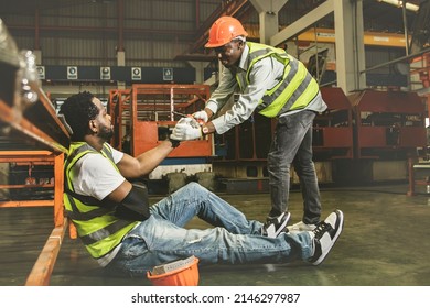 Friendship And Sympathy For Workers Injured During Work Concept : Male African American Worker Injured In Arm Wearing Cast Sits In Pain Gets Sympathy For Help To Take Sick Leave To Heal.