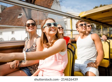 Friendship, Travel, Vacation, Summer And People Concept - Group Of Smiling Friends Traveling By Tour Bus