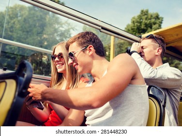 Friendship, Travel, Vacation, Summer And People Concept - Smiling Couple Looking To City Guide Book Traveling By Tour Bus