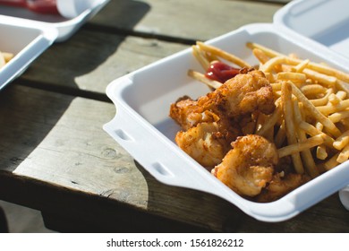 Fries chicken and french fries in the take away box