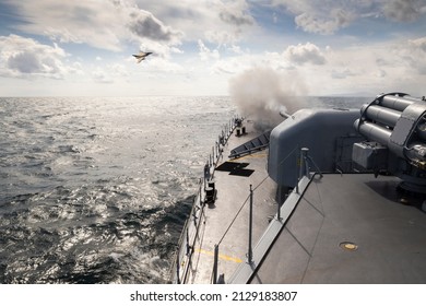 A Frigate Of Navy Makes Missile Launch During Fighting With Military Aircraft. War Ship Shoot With Gun.