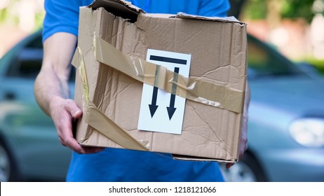 Frightened Delivery Worker Giving Broken Customer Parcel, Shipment Accident