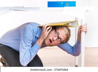 Frightened Employee Hiding Under The Desk - Studio Shoot 