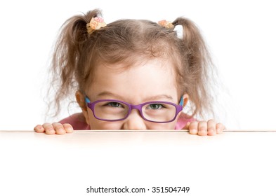 Frightened Kid In Spectacles Looking From Under Table Desk 