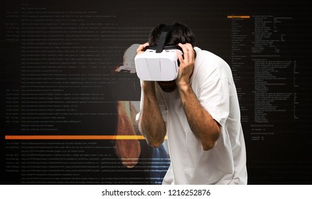 Frightened man using VR glasses inside the virtual reality mode
