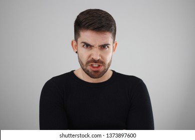frightened young man angry grumpy - feeling angry - whit space for caption or text
