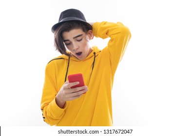 Frightened Young Man Watching Mobile Phone