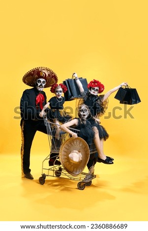 Frightening zombie family celebrating Halloween in shop, market, shopping over bright yellow studio background. Concept of autumn, holidays, horror, body art, black friday, big sale. ad.