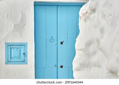 Frigiliana, Malaga, Spain - October 2021. Street and blue door and white walls typical of the village of Frigiliana in the province of Malaga. Andalusia, Spain. - Shutterstock ID 2091644344