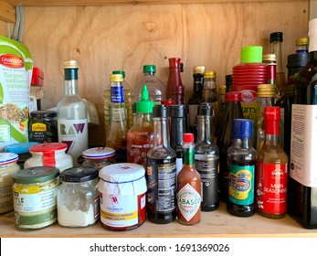 Frilford, Oxfordshire / U.K. - April 2 2020: Pantry shelf with condiments. 