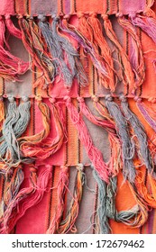 Fringe of a colorful rug as a background