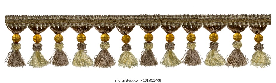 Fringe. Light brown braid with tassels and yellow beads. Isolated on white background