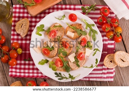 Similar – Image, Stock Photo Bruschetta with cream cheese, cherry tomatoes and basil